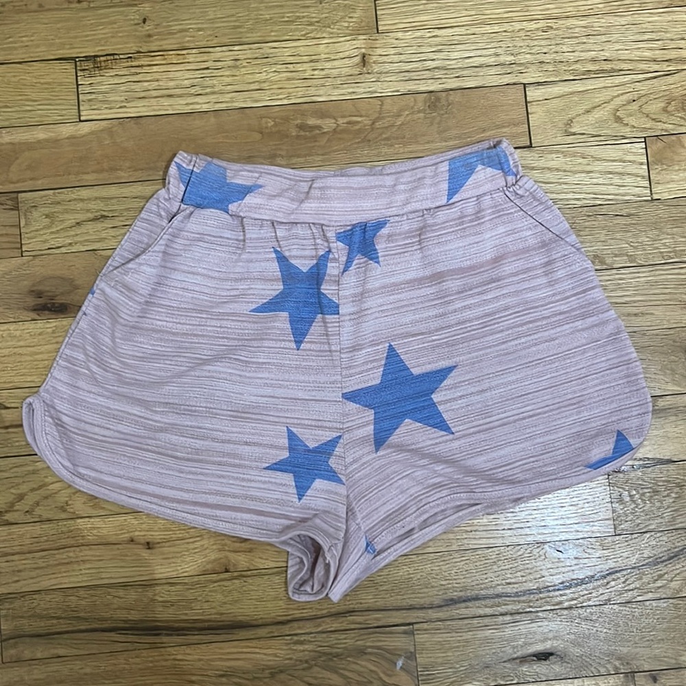 Pink lounge shorts with blue stars and pockets